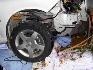 couple-pinned-under-car.jpg